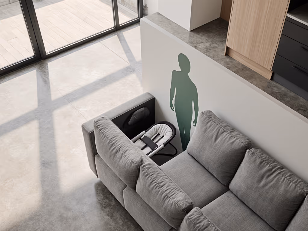 urban_apartment_nursery_with_bouncer_tucked_behind_sofa
